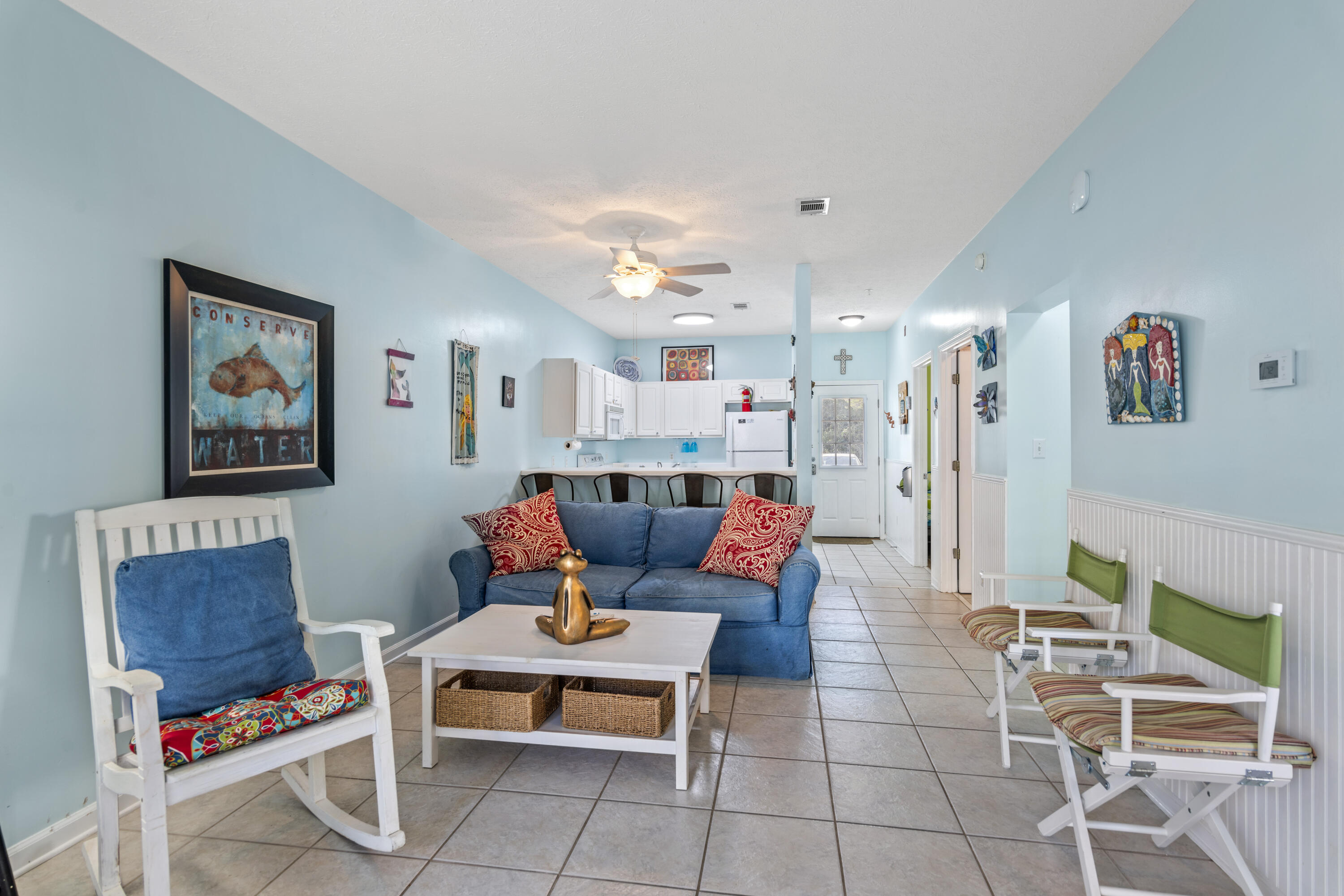 34 Heron's Watch Way, Unit 2104 Santa Rosa Beach, FL 32459 - Photo 8 of 24 a living room with furniture and a dining table with wooden floor