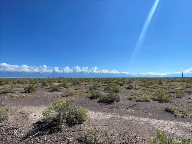 a view of a lake in middle of forest