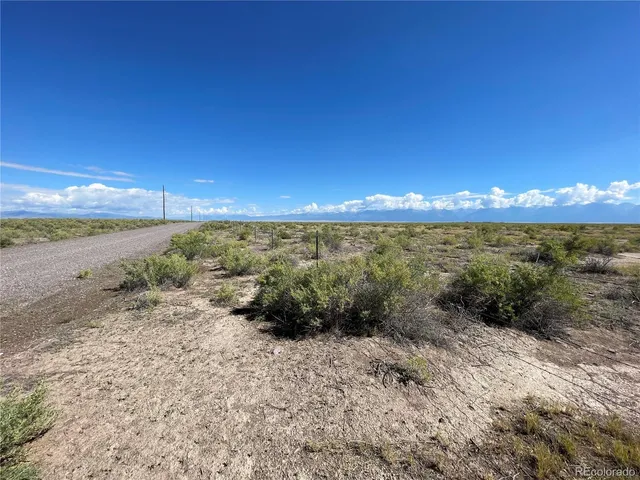 a view of an ocean beach and mountain