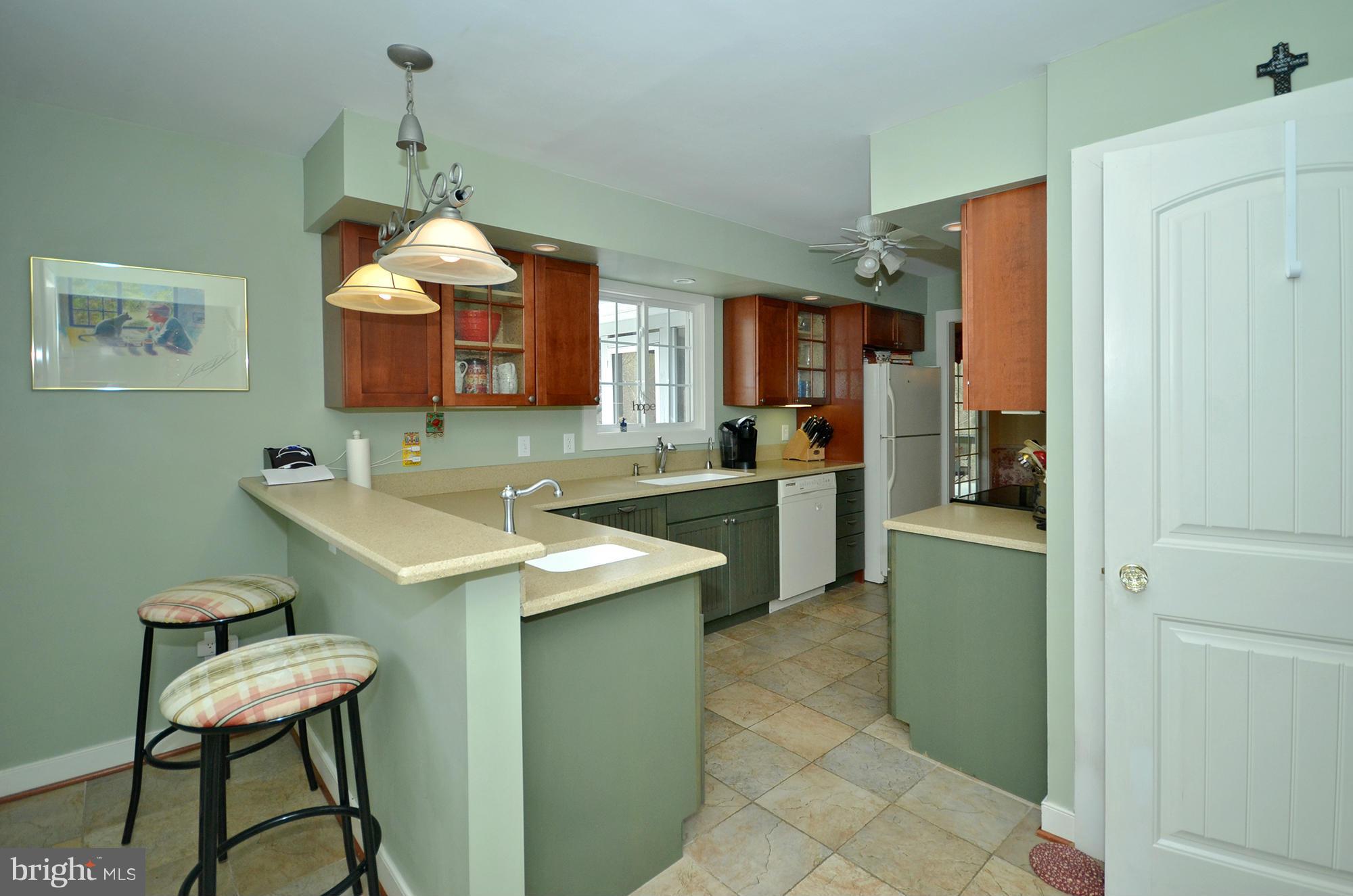 14045 Sunnybrook Road Phoenix, MD 21131 - Photo 11 of 27 a kitchen with a sink cabinets and stainless steel appliances