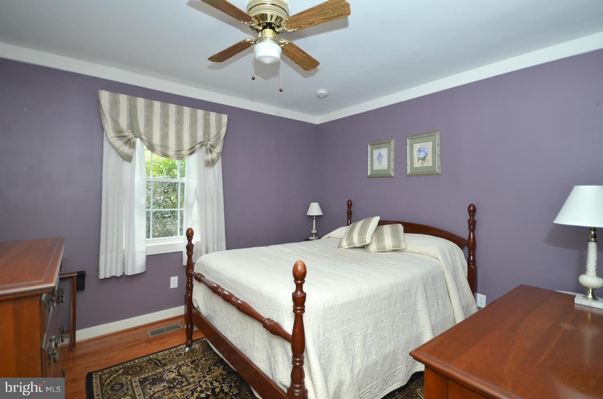 14045 Sunnybrook Road Phoenix, MD 21131 - Photo 18 of 27 a bedroom with a bed and a chandelier