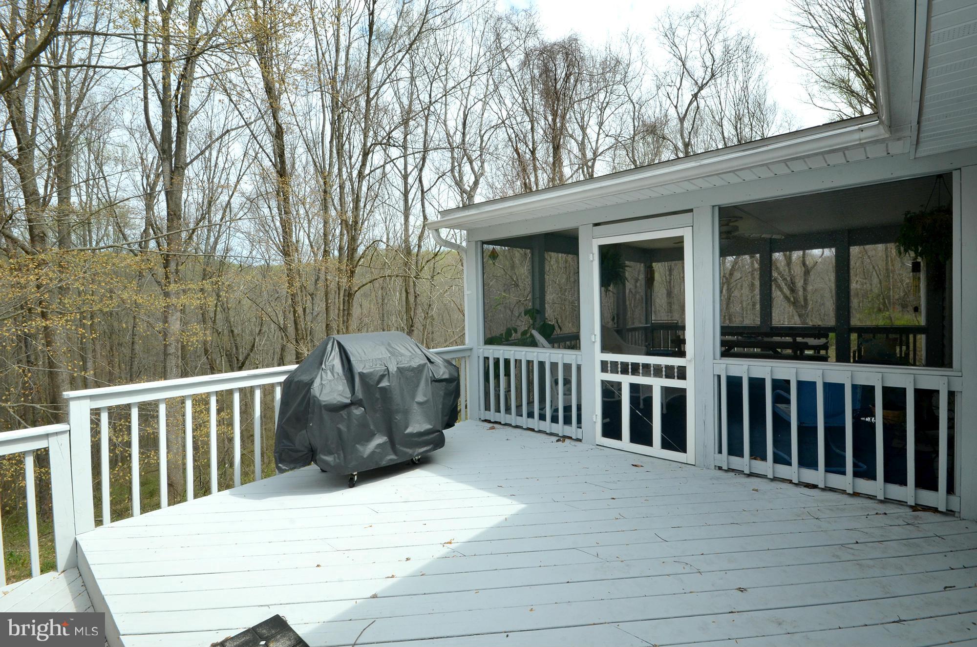 14045 Sunnybrook Road Phoenix, MD 21131 - Photo 21 of 27 a view of a chair and table in the balcony