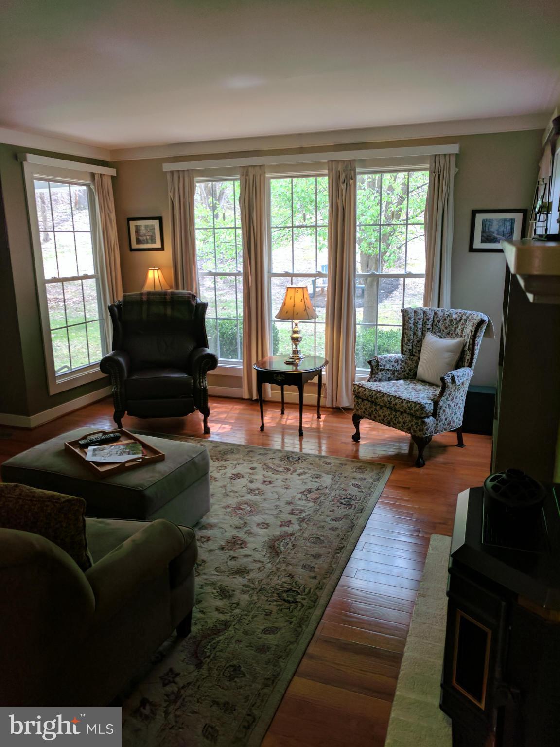 14045 Sunnybrook Road Phoenix, MD 21131 - Photo 5 of 27 a living room with furniture and a flat screen tv