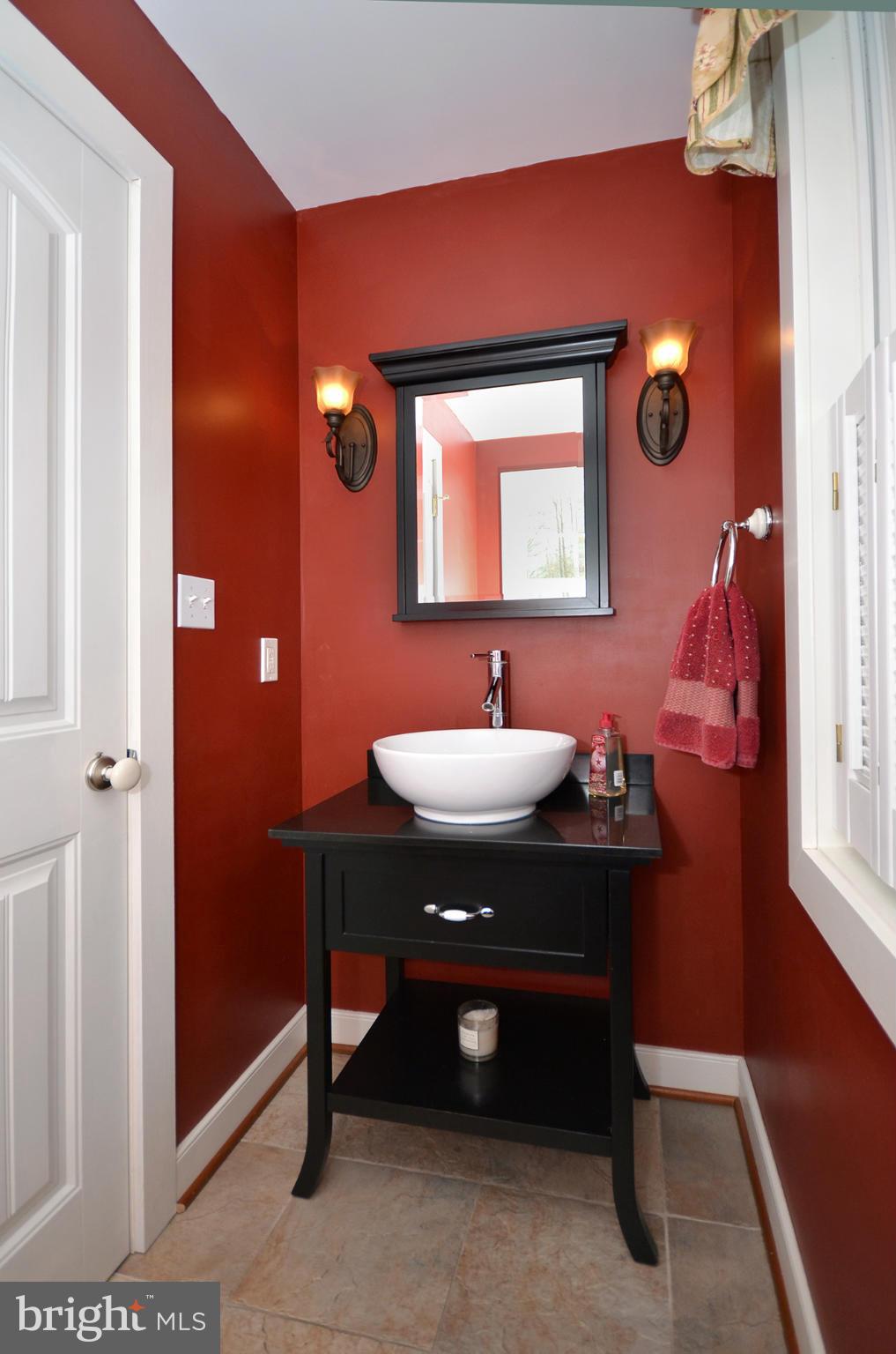 14045 Sunnybrook Road Phoenix, MD 21131 - Photo 9 of 27 a bathroom with a sink and a mirror