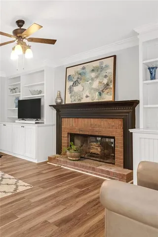 a living room with fireplace and a fireplace