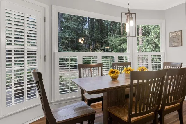 a view of a dining room with furniture window and outside view