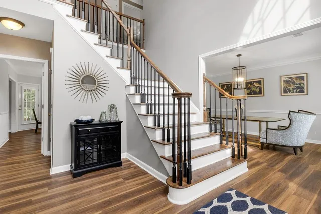 a view of entryway livingroom and hall with wooden floor