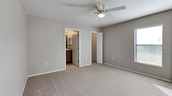 a bathroom with a sink toilet and a mirror