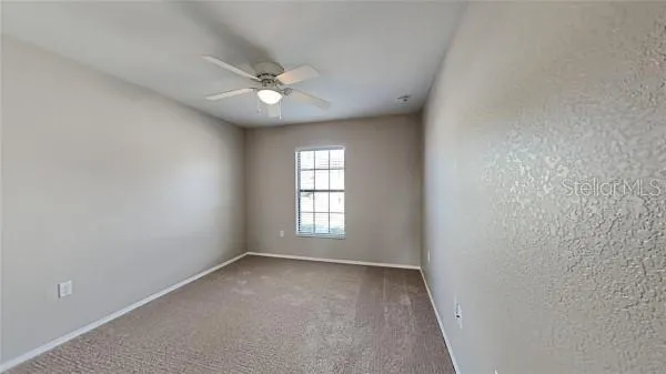 an empty room with a bathroom