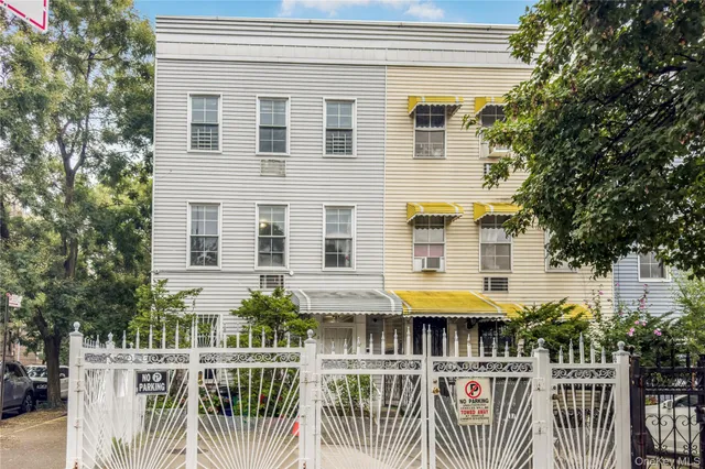 a view of a building with glass door and deck