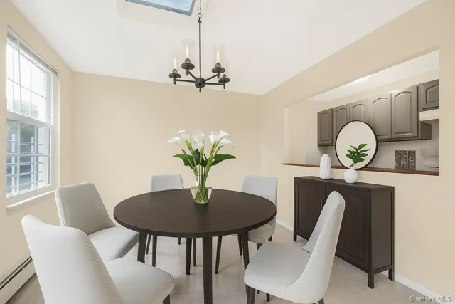 a dining room with furniture and window