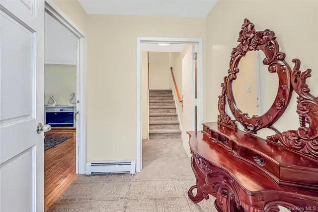 a view of an entryway with wooden floor