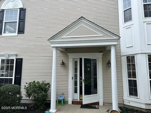 a front view of a house with a white house