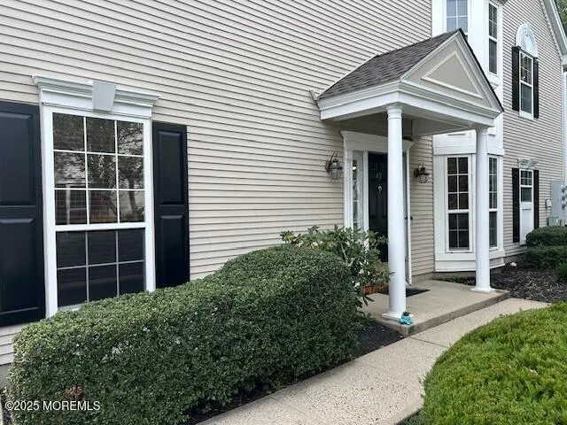 a view of a house with a yard and plants