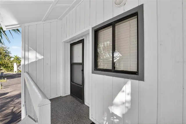 a kitchen with stainless steel appliances granite countertop a refrigerator a stove top oven a sink and dishwasher with wooden floor