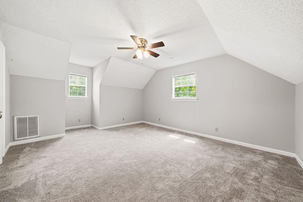 116 Monterey Drive Dalton, GA 30721 - Photo 32 of 39 an empty room with windows and fan