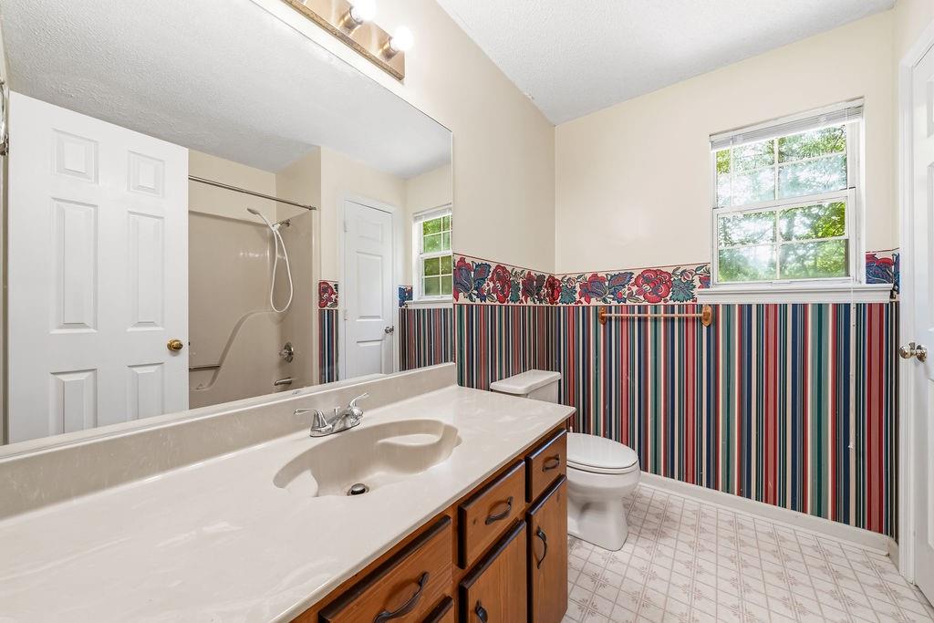 116 Monterey Drive Dalton, GA 30721 - Photo 34 of 39 a bathroom with a sink and a mirror