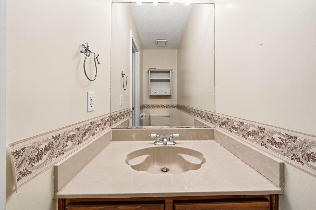 116 Monterey Drive Dalton, GA 30721 - Photo 36 of 39 a bathroom with a sink and a mirror