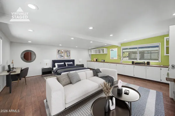 a kitchen with granite countertop white cabinets and stainless steel appliances