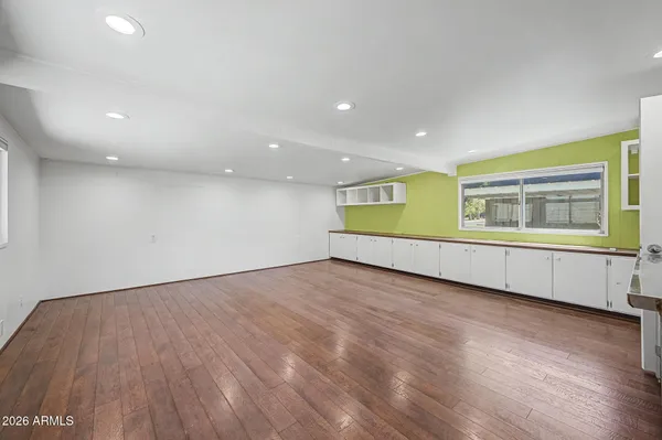 a view of a backyard with swimming pool