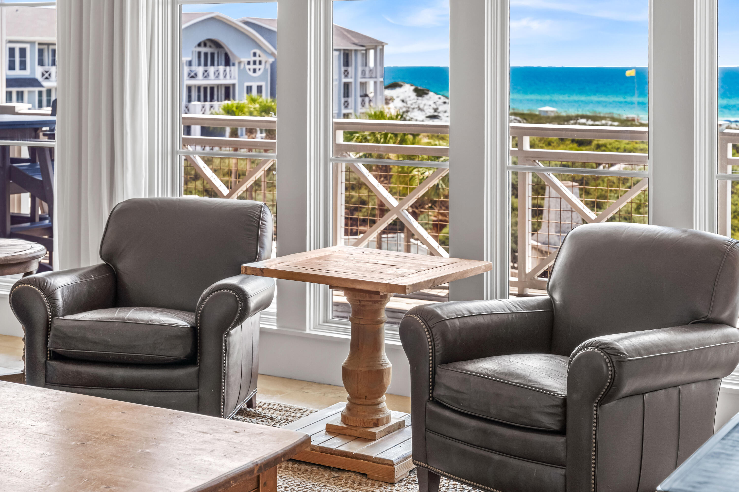 337 Bridge Lane, Unit 421B Watersound, FL 32461 - Photo 13 of 55 a living room with furniture a window and a flat screen tv