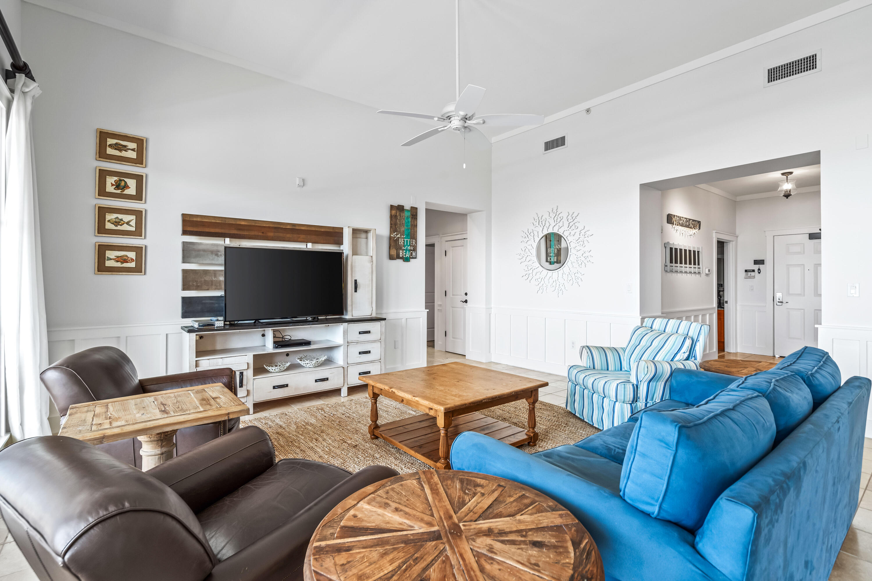 337 Bridge Lane, Unit 421B Watersound, FL 32461 - Photo 18 of 55 a living room with furniture and a flat screen tv