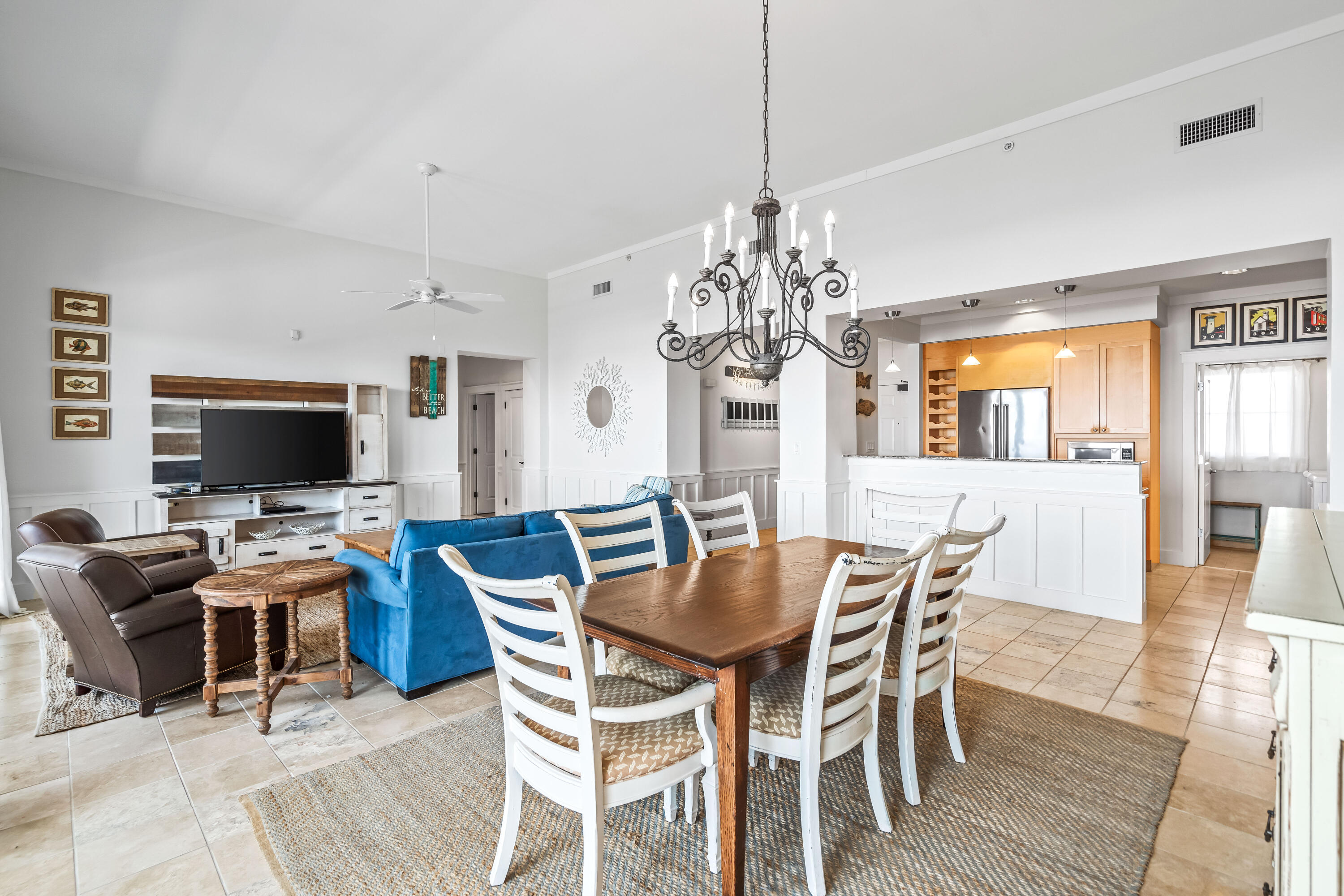 337 Bridge Lane, Unit 421B Watersound, FL 32461 - Photo 20 of 55 a view of a dining room with furniture wooden floor and chandelier