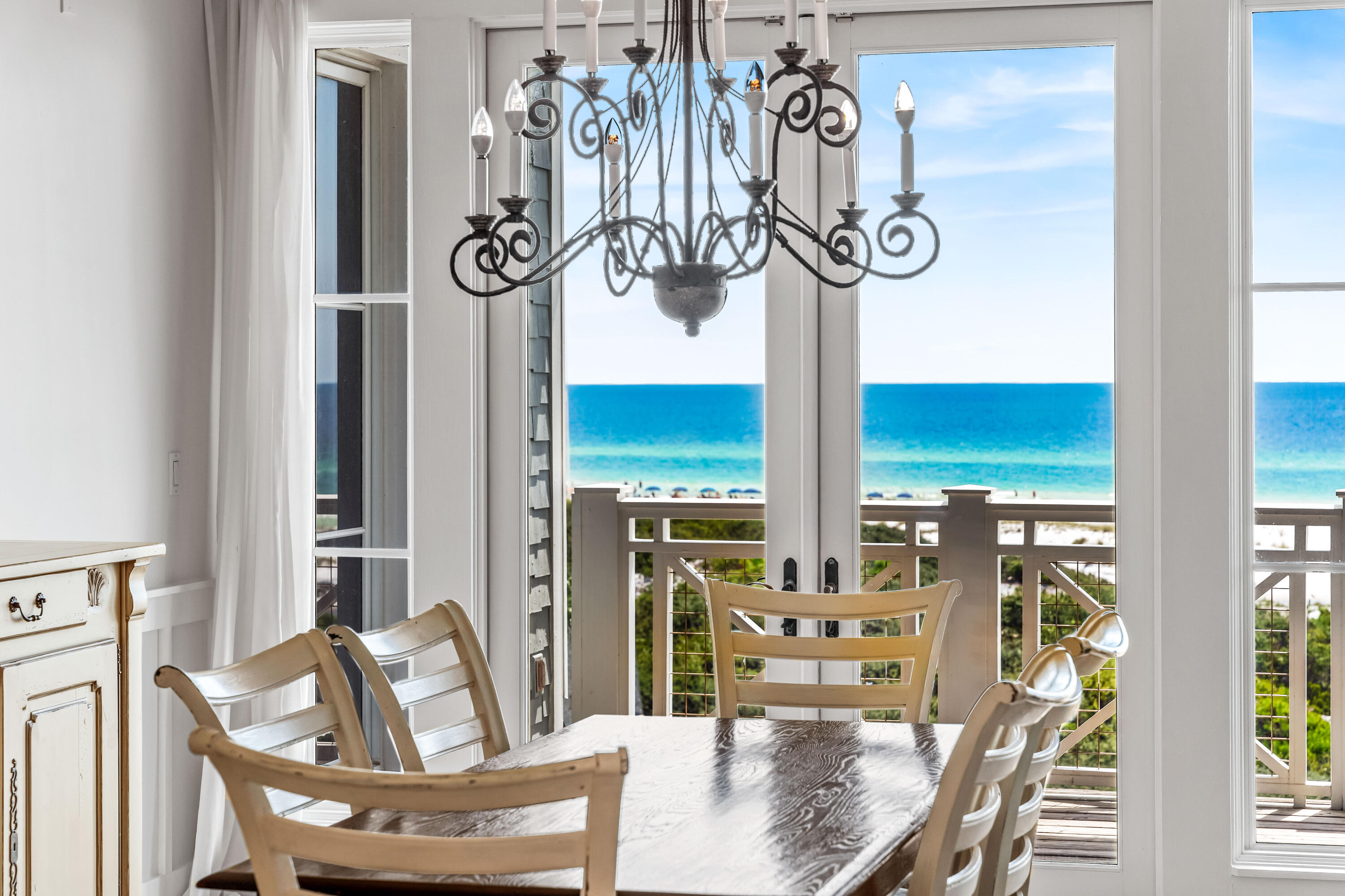 337 Bridge Lane, Unit 421B Watersound, FL 32461 - Photo 22 of 55 a front view of a dining room with furniture wooden floor and windows
