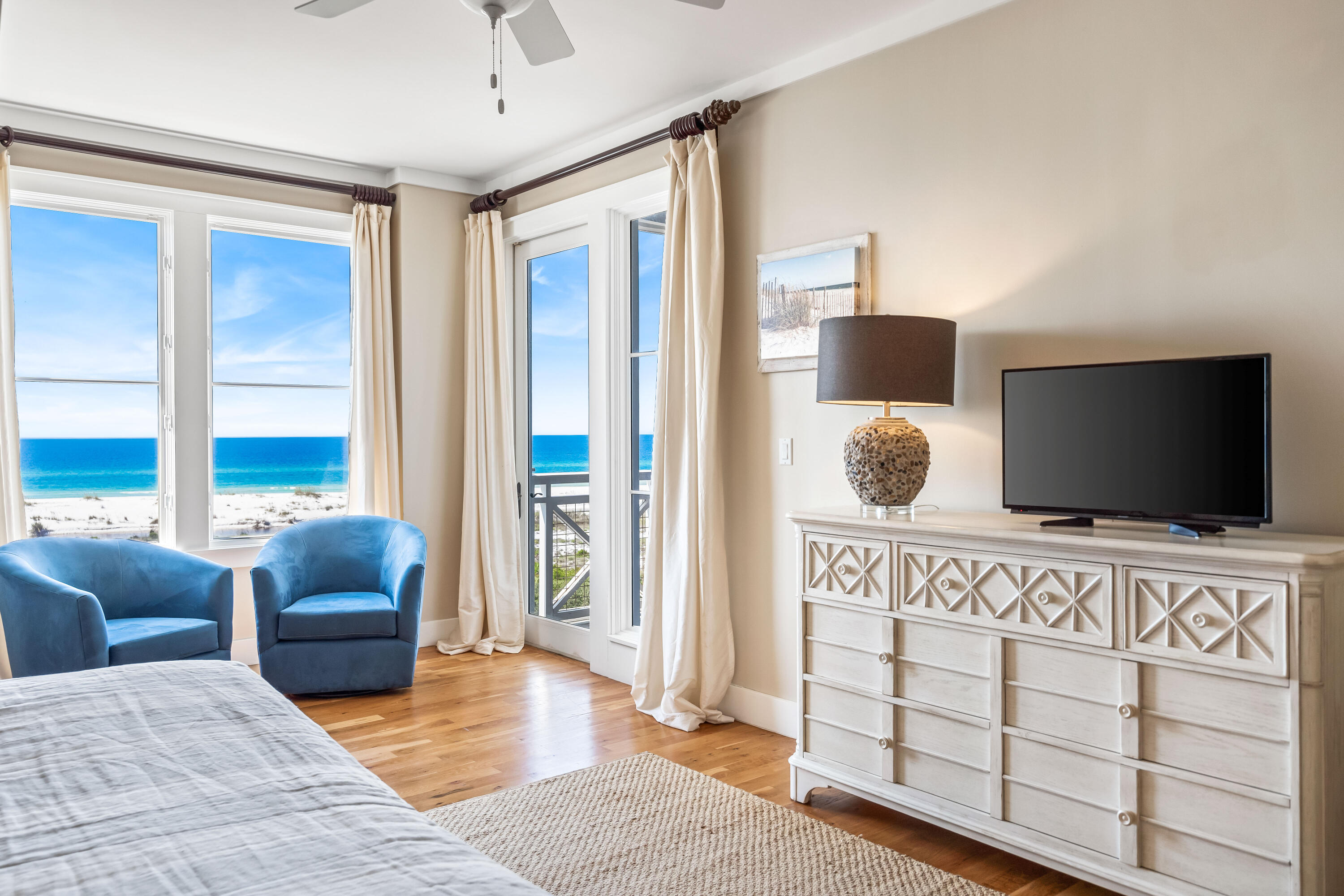 337 Bridge Lane, Unit 421B Watersound, FL 32461 - Photo 28 of 55 a bedroom with furniture and a flat screen tv