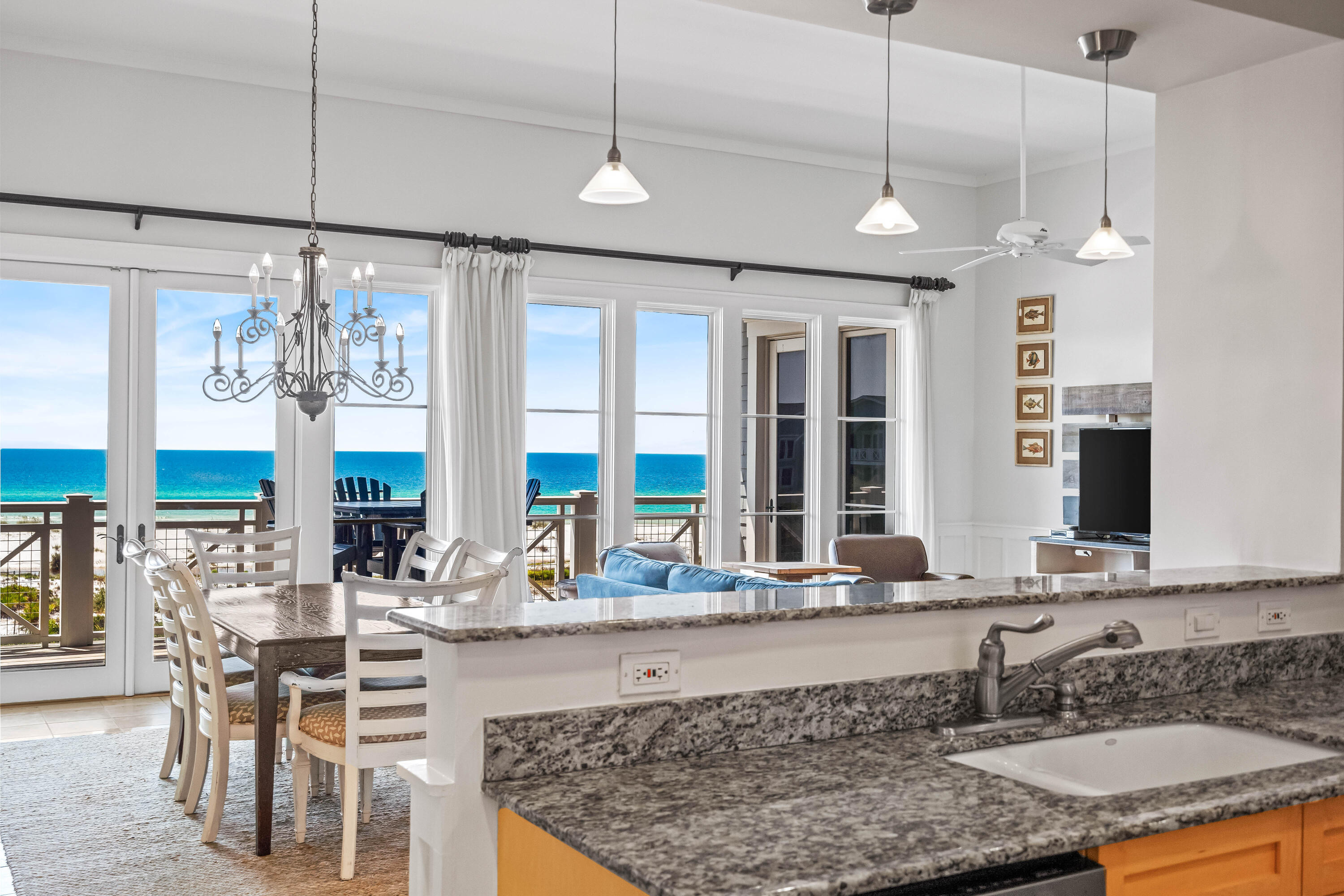 337 Bridge Lane, Unit 421B Watersound, FL 32461 - Photo 3 of 55 a large kitchen with a table and chairs in it