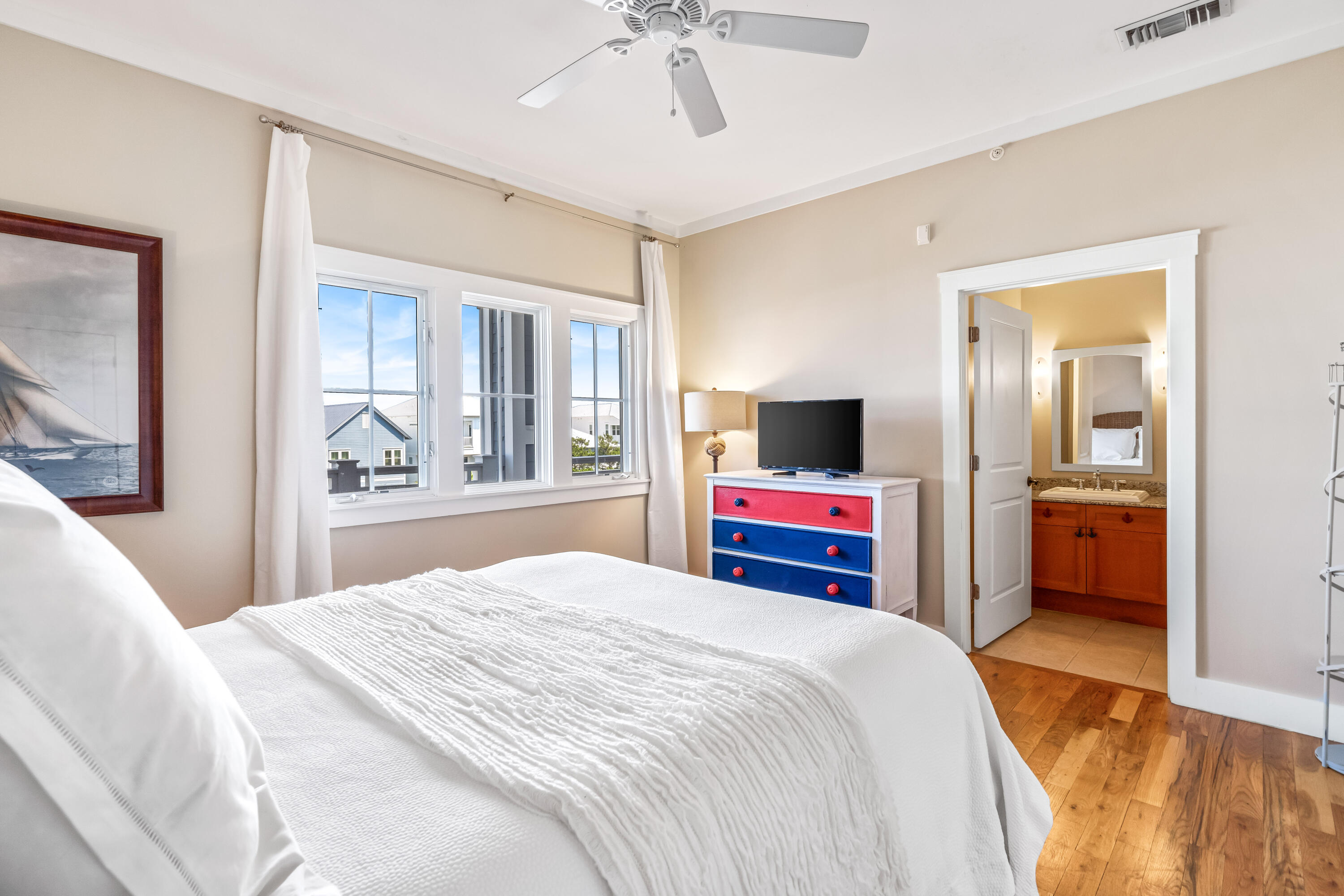 337 Bridge Lane, Unit 421B Watersound, FL 32461 - Photo 32 of 55 a bedroom with a bed and a flat screen tv