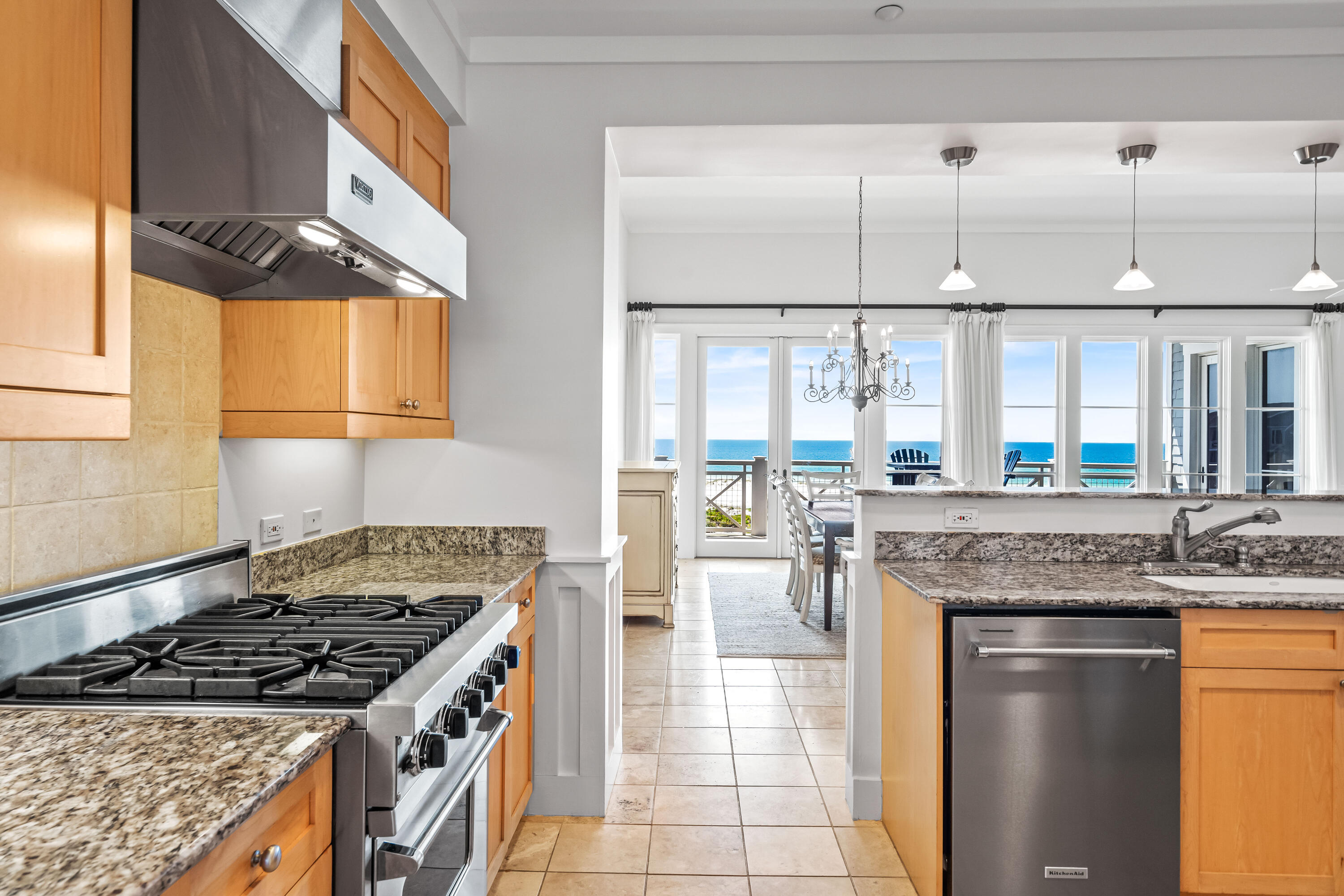 337 Bridge Lane, Unit 421B Watersound, FL 32461 - Photo 38 of 55 a kitchen with stainless steel appliances granite countertop a stove and a white cabinets