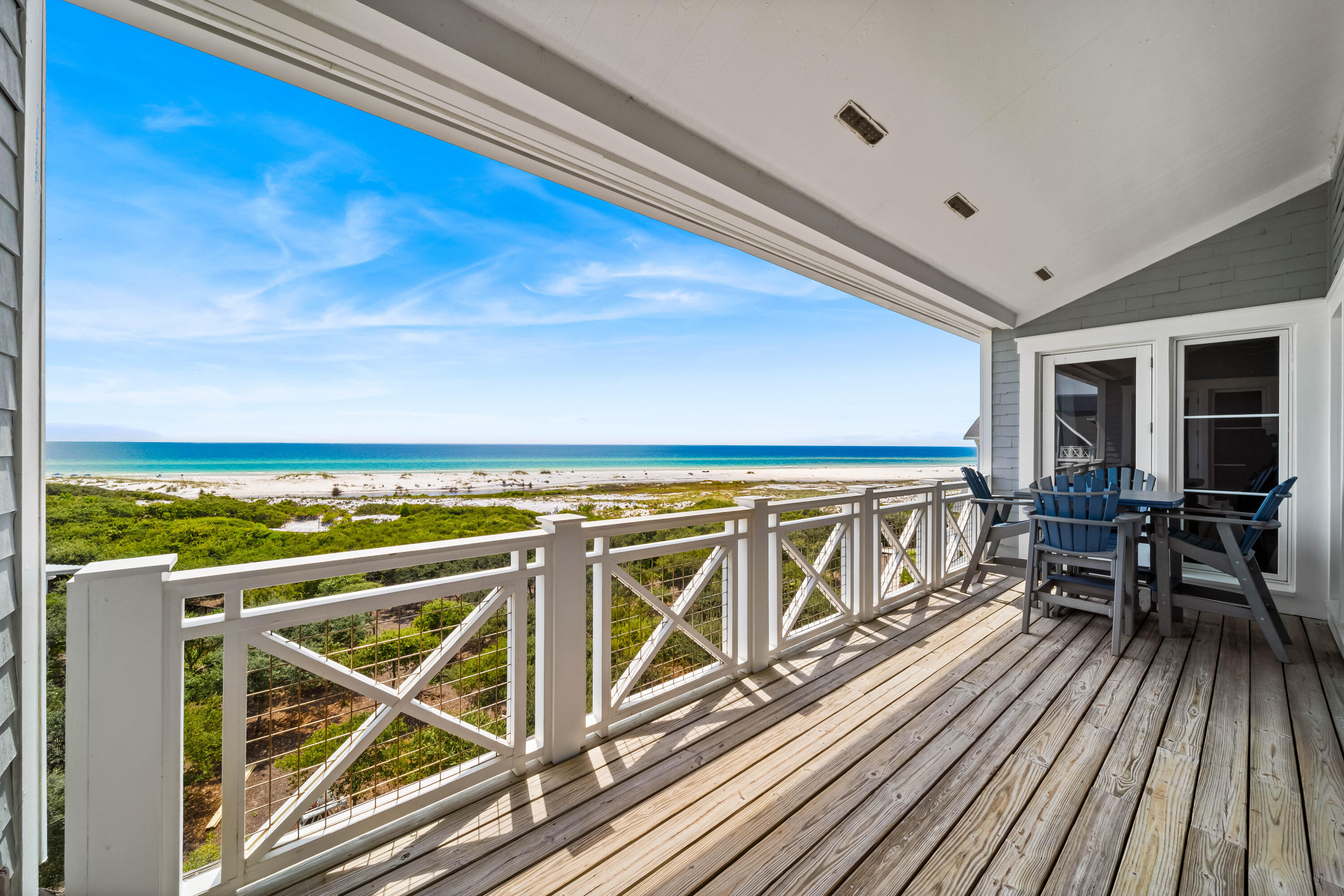 337 Bridge Lane, Unit 421B Watersound, FL 32461 - Photo 43 of 55 a view of a roof deck with wooden floor and seating space