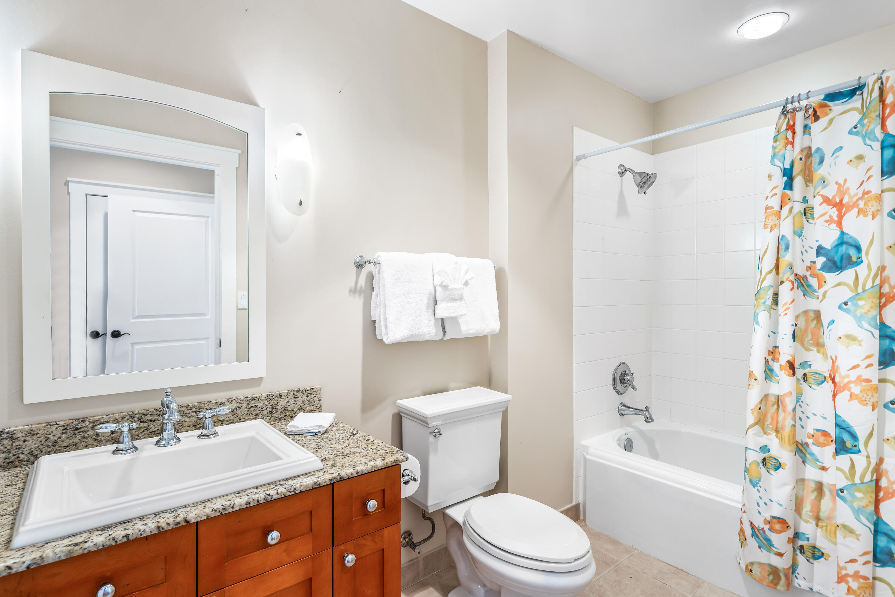 337 Bridge Lane, Unit 421B Watersound, FL 32461 - Photo 53 of 55 a bathroom with a sink a toilet and a bathtub