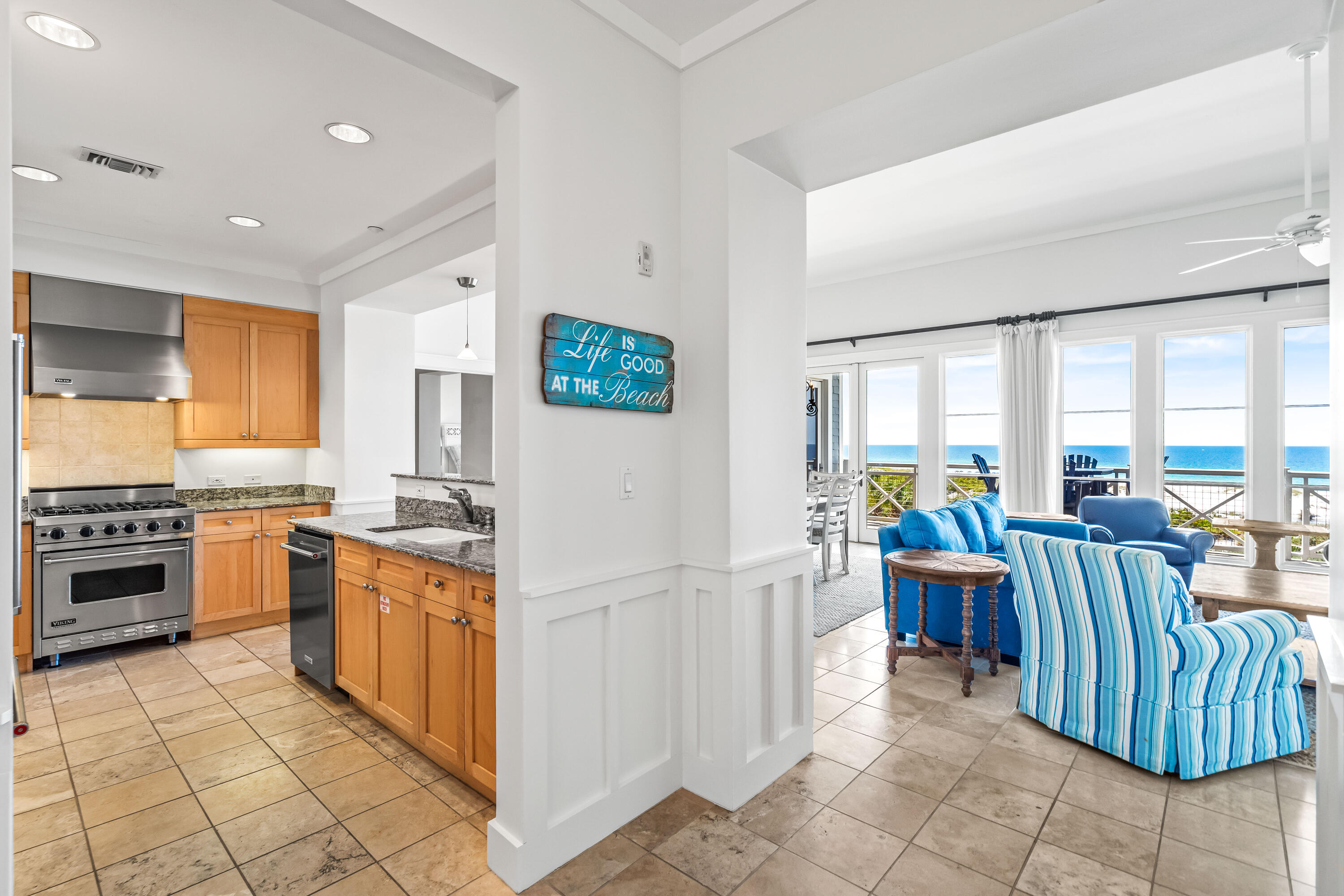 337 Bridge Lane, Unit 421B Watersound, FL 32461 - Photo 10 of 55 a kitchen with stainless steel appliances granite countertop a refrigerator and a stove top oven