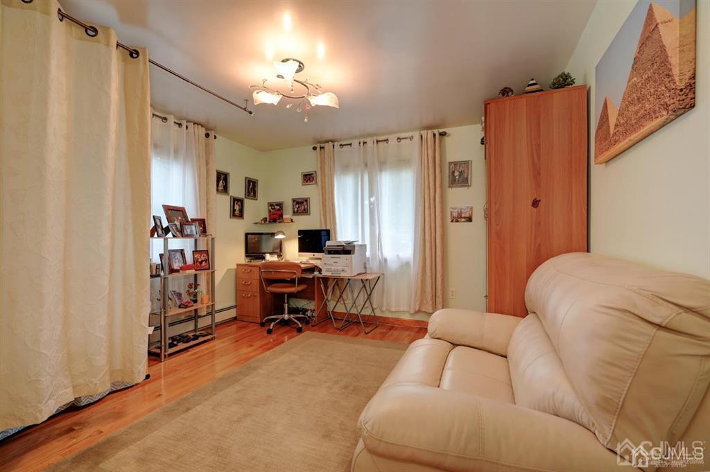 414 Inwood Road Linden, NJ 07036 - Photo 12 of 33 a bedroom with furniture and a window
