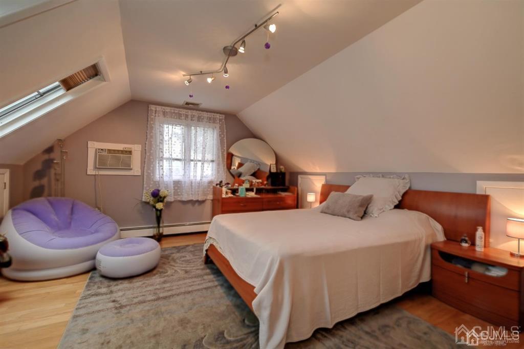 414 Inwood Road Linden, NJ 07036 - Photo 14 of 33 a bedroom with a bed and window