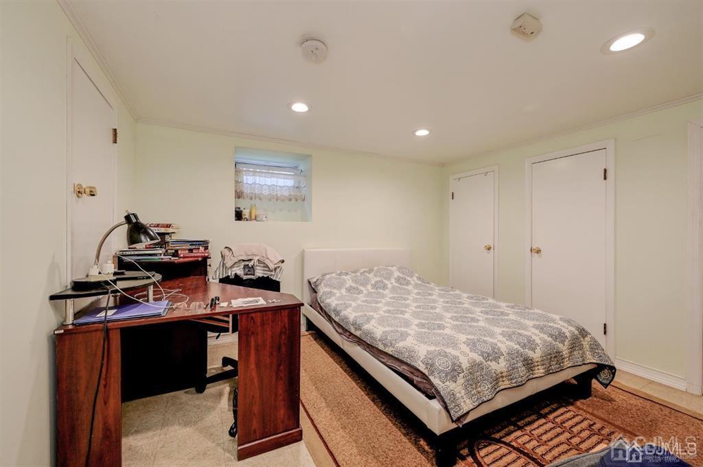 414 Inwood Road Linden, NJ 07036 - Photo 17 of 33 a bedroom with a bed and a desk
