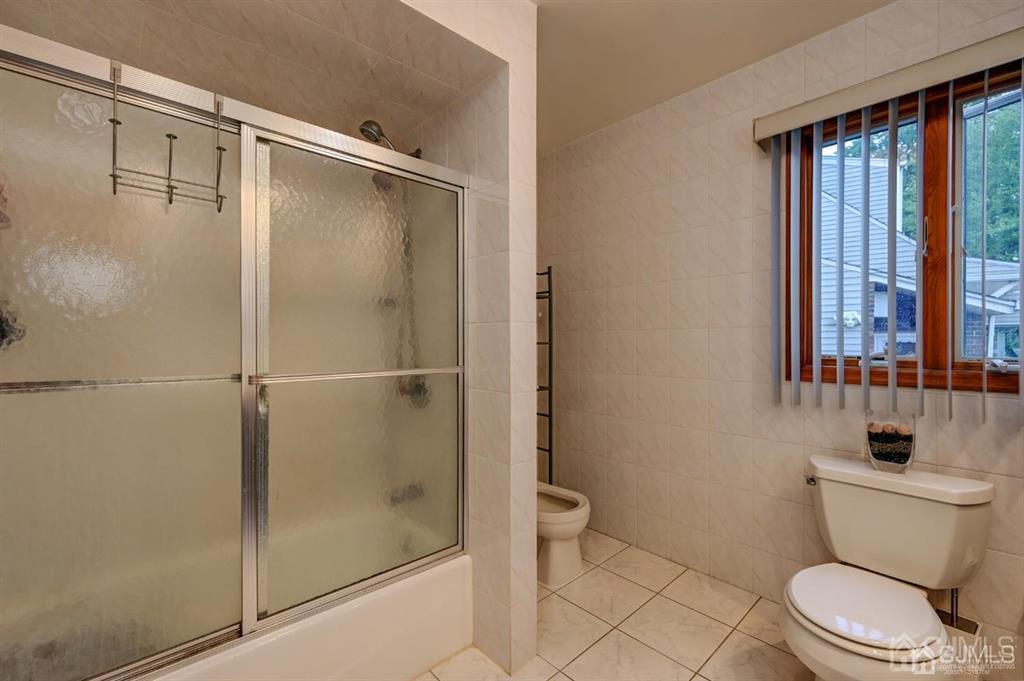 414 Inwood Road Linden, NJ 07036 - Photo 21 of 33 a bathroom with a toilet and a shower