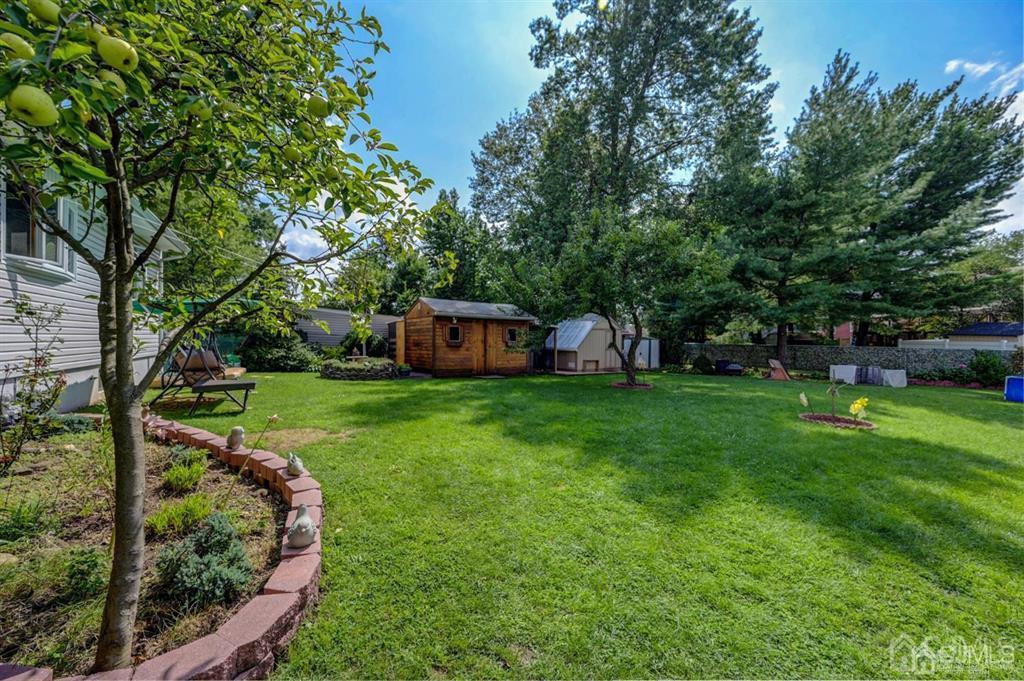 414 Inwood Road Linden, NJ 07036 - Photo 29 of 33 a view of a house with backyard sitting area and garden
