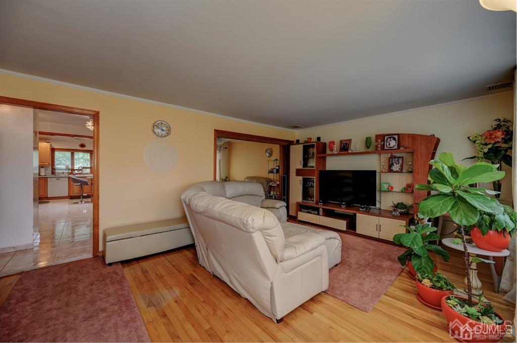 414 Inwood Road Linden, NJ 07036 - Photo 4 of 33 a living room with furniture and a potted plant