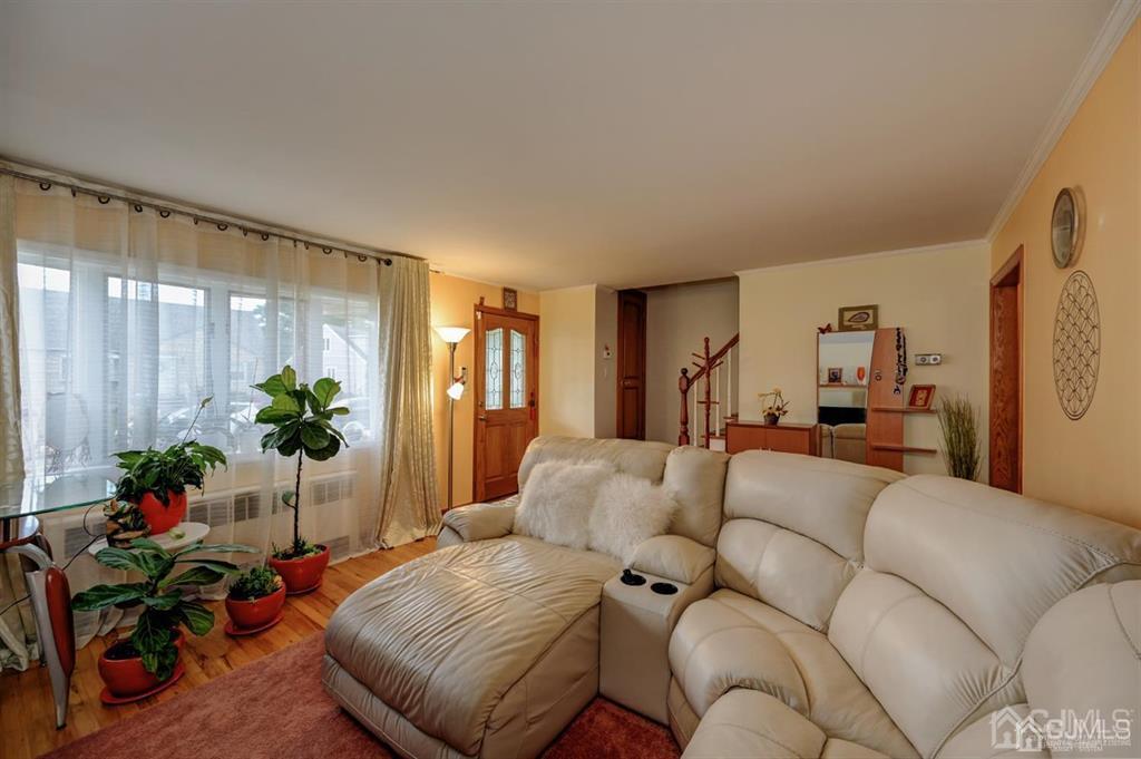 414 Inwood Road Linden, NJ 07036 - Photo 5 of 33 a living room with furniture potted plant and a window