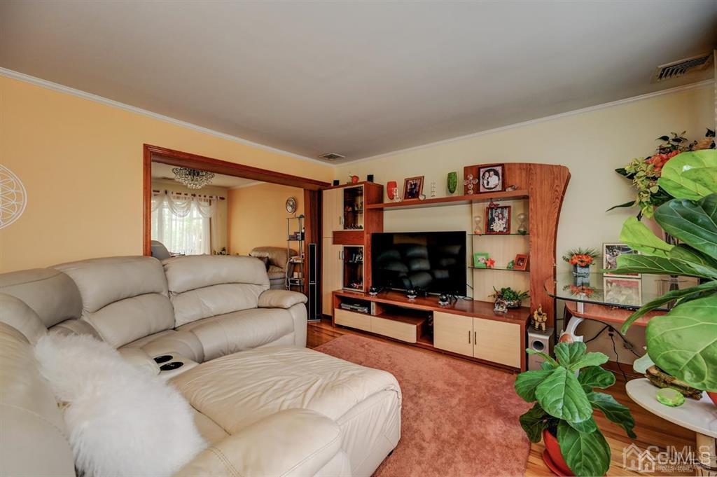 414 Inwood Road Linden, NJ 07036 - Photo 6 of 33 a living room with furniture and a flat screen tv