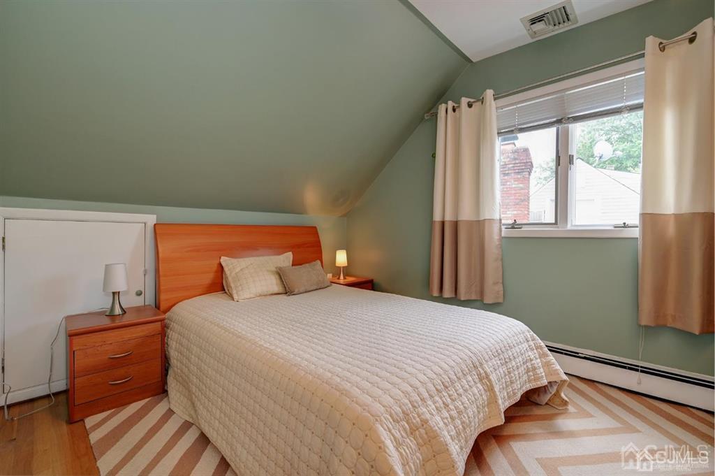 414 Inwood Road Linden, NJ 07036 - Photo 8 of 33 a bedroom with a bed and a window