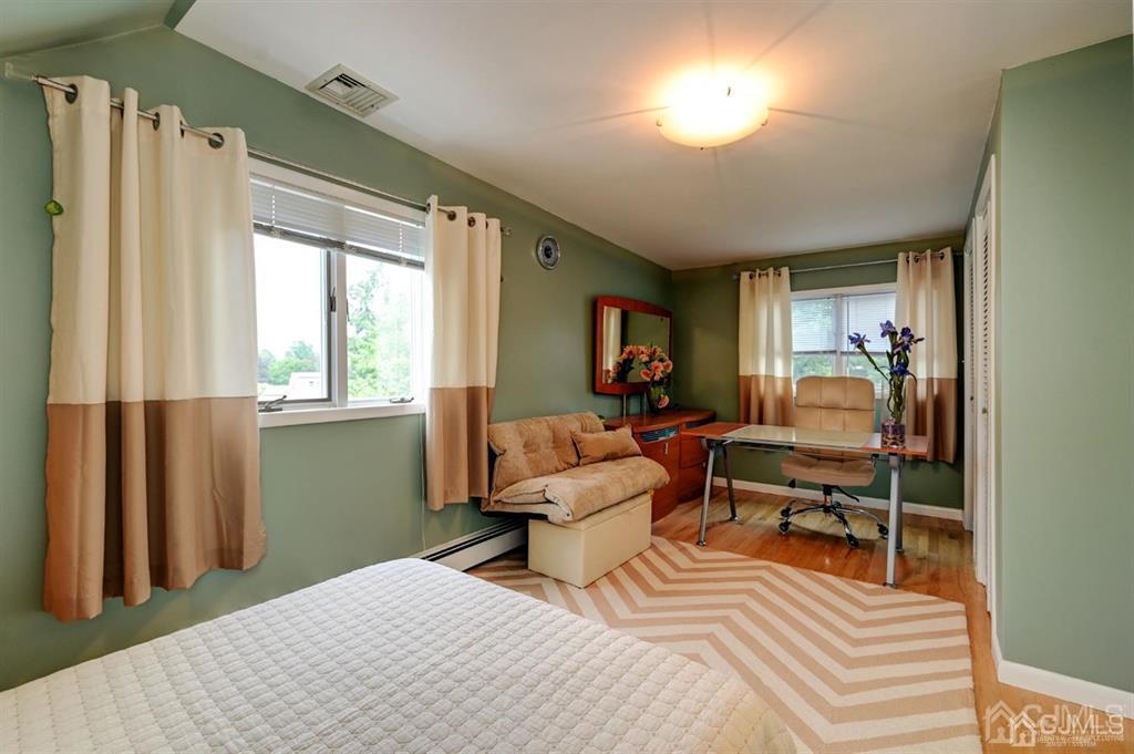 414 Inwood Road Linden, NJ 07036 - Photo 9 of 33 a bedroom with furniture and a window
