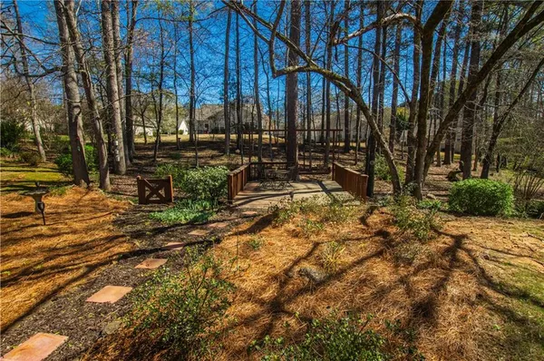 a view of outdoor space with wooden fence