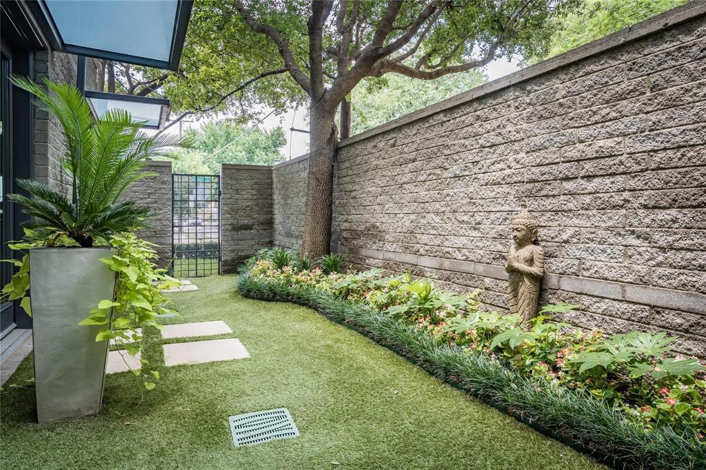 2630 Welborn Street Dallas, TX 75219 - Photo 11 of 40 a garden view with a seating space