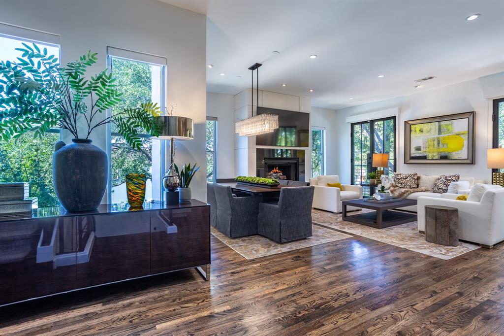 2630 Welborn Street Dallas, TX 75219 - Photo 15 of 40 a living room with furniture and a fireplace