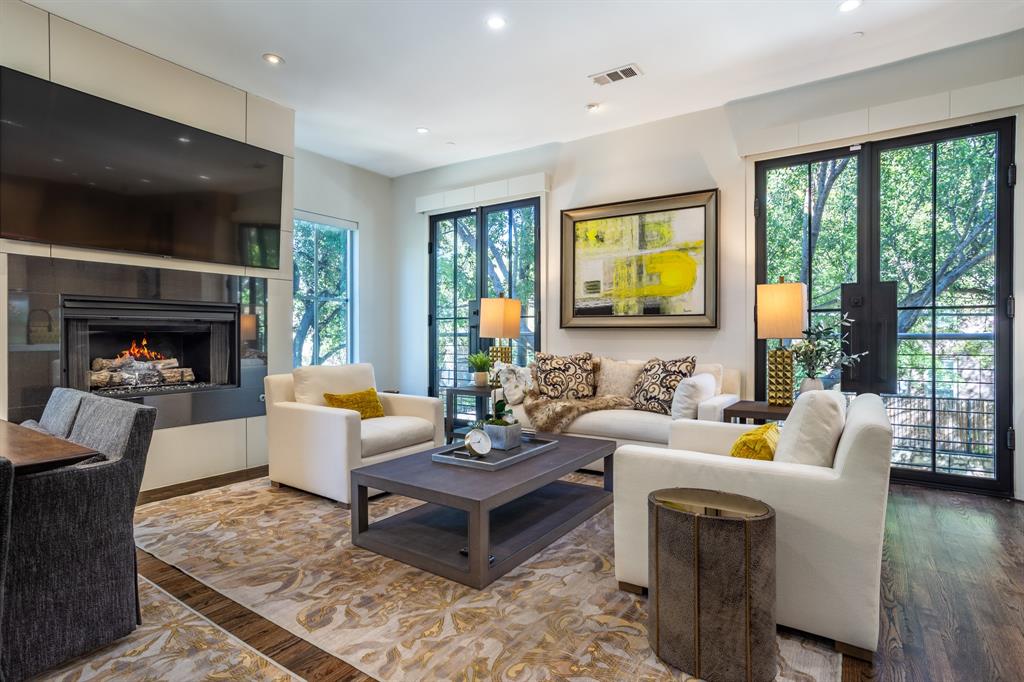 2630 Welborn Street Dallas, TX 75219 - Photo 16 of 40 a living room with furniture fireplace and a large window
