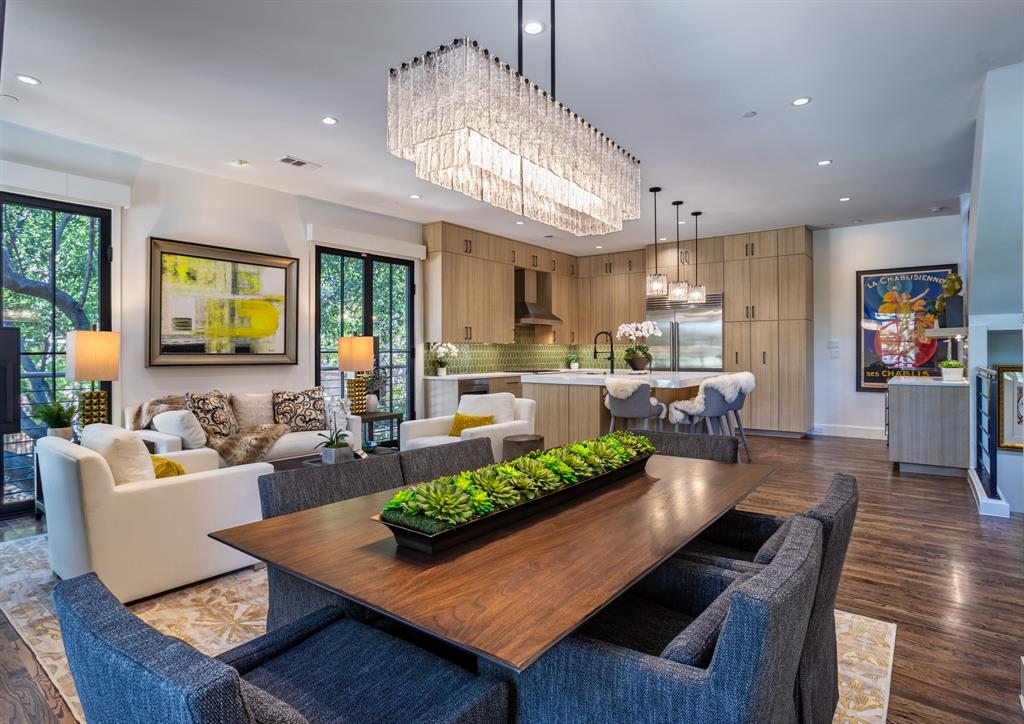2630 Welborn Street Dallas, TX 75219 - Photo 17 of 40 a living room with fireplace furniture and a chandelier